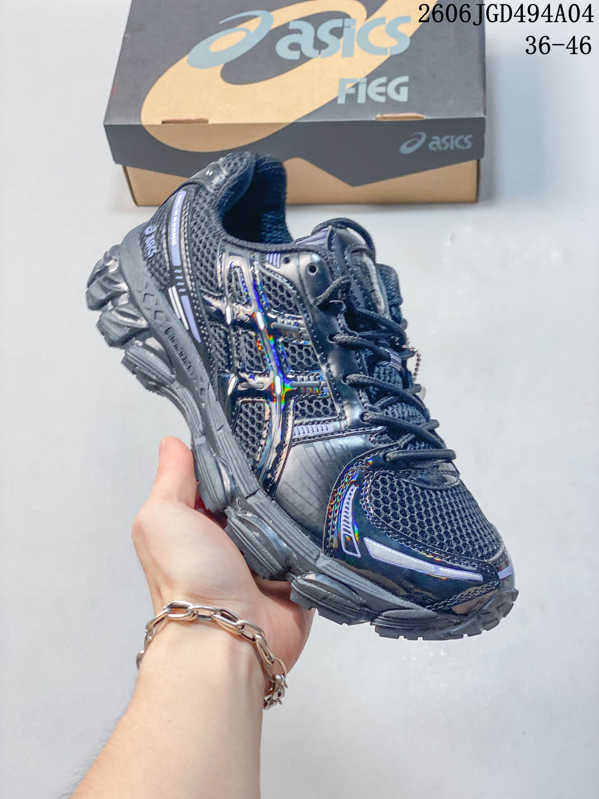 Angled side view of the dark gray sneaker showing its layered upper and sculpted sole