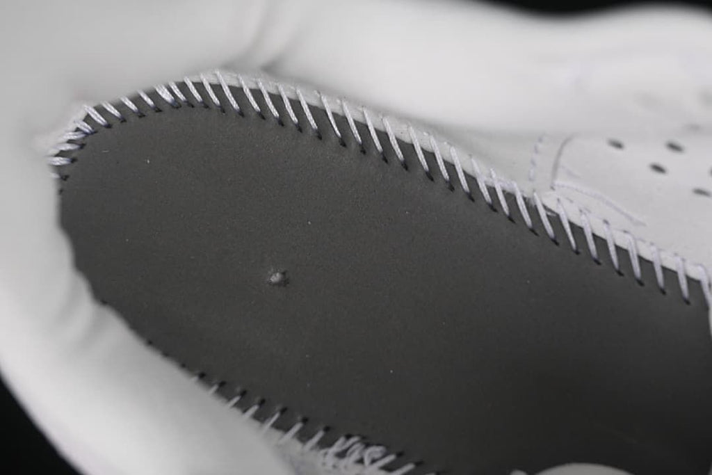 Close-up of stitched construction on the shoe interior.