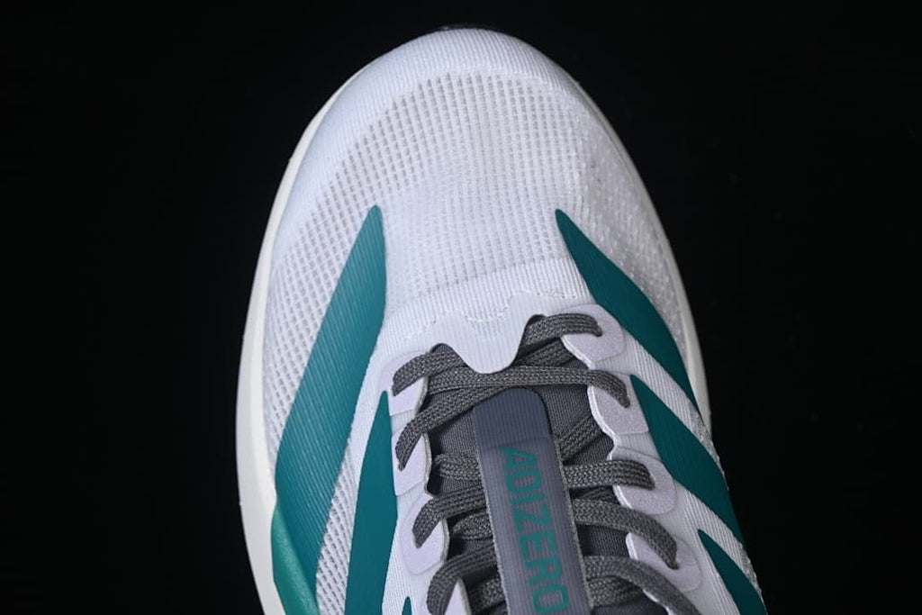 Top view of the toe and lace area with teal side stripes.