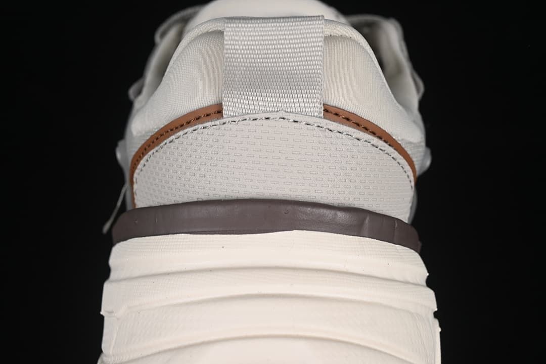 Rear view showing the heel pull tab and layered sole