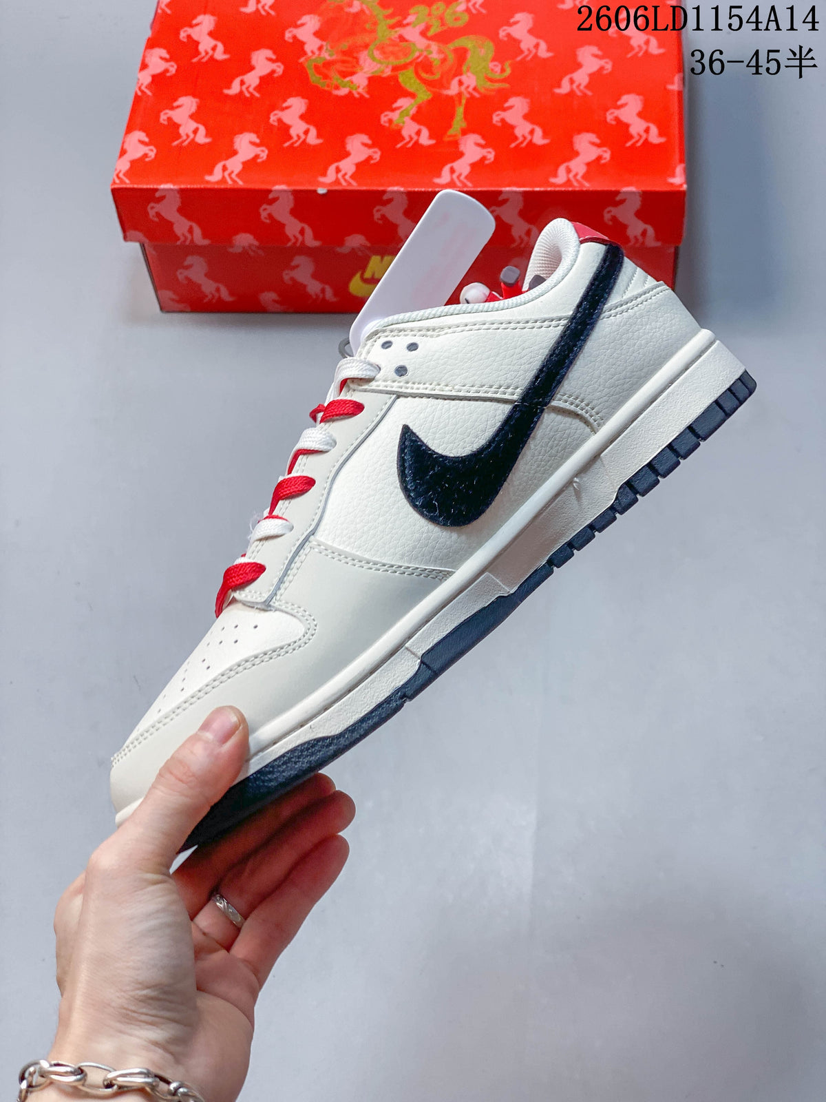 Side profile showing the dark Swoosh, off-white upper, and red-and-white laces