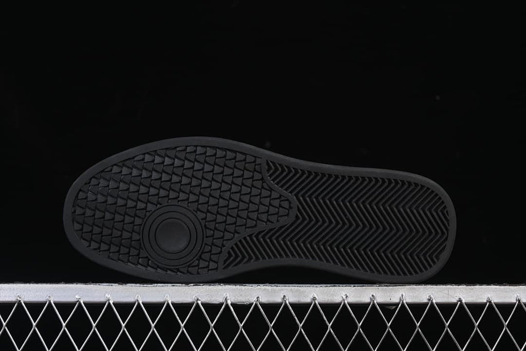 Underside showing the black outsole tread pattern