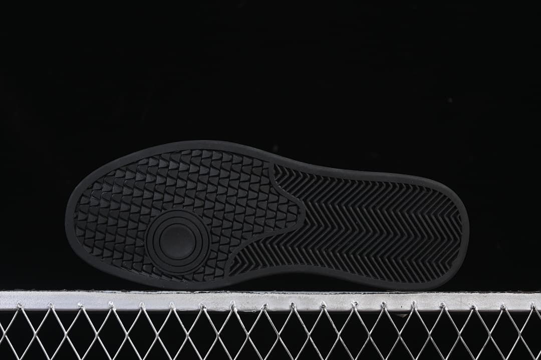 Underside showing the black outsole tread pattern