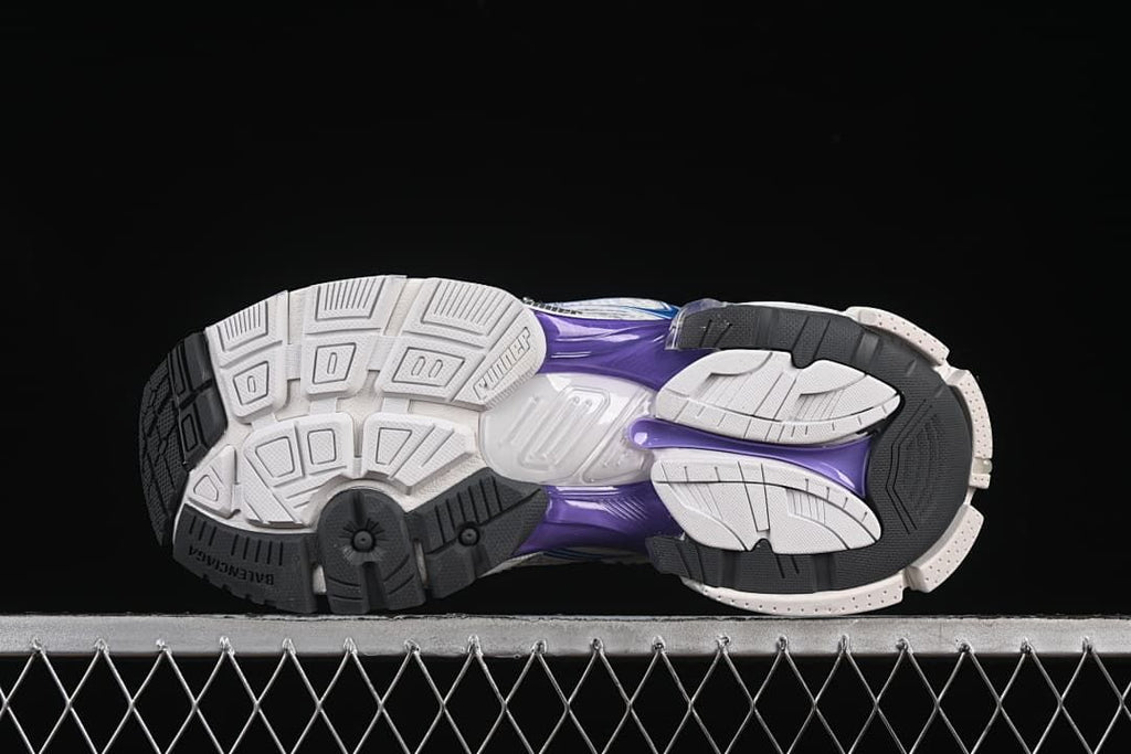 Outsole view showing segmented white and black tread with purple sections