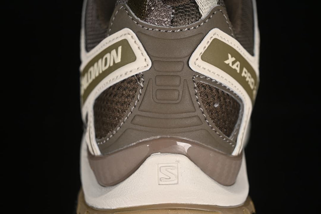 Rear view of the shoe showing its heel structure and Salomon branding.