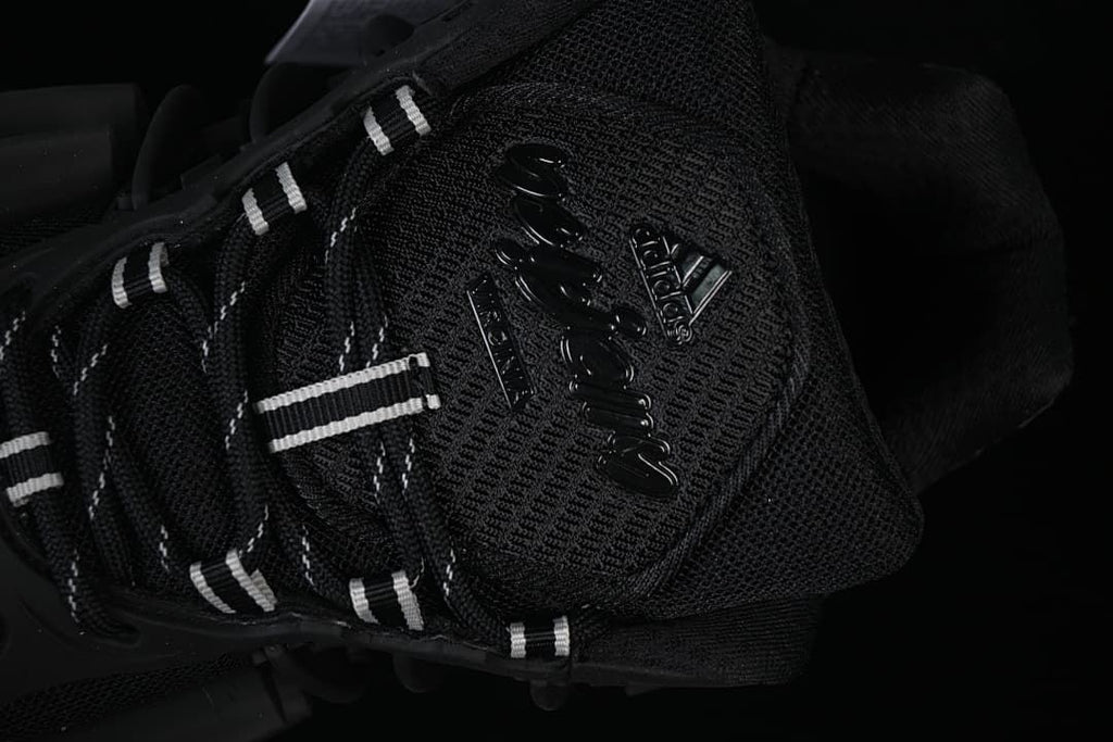 Close-up of the tongue branding and black-and-white laces.