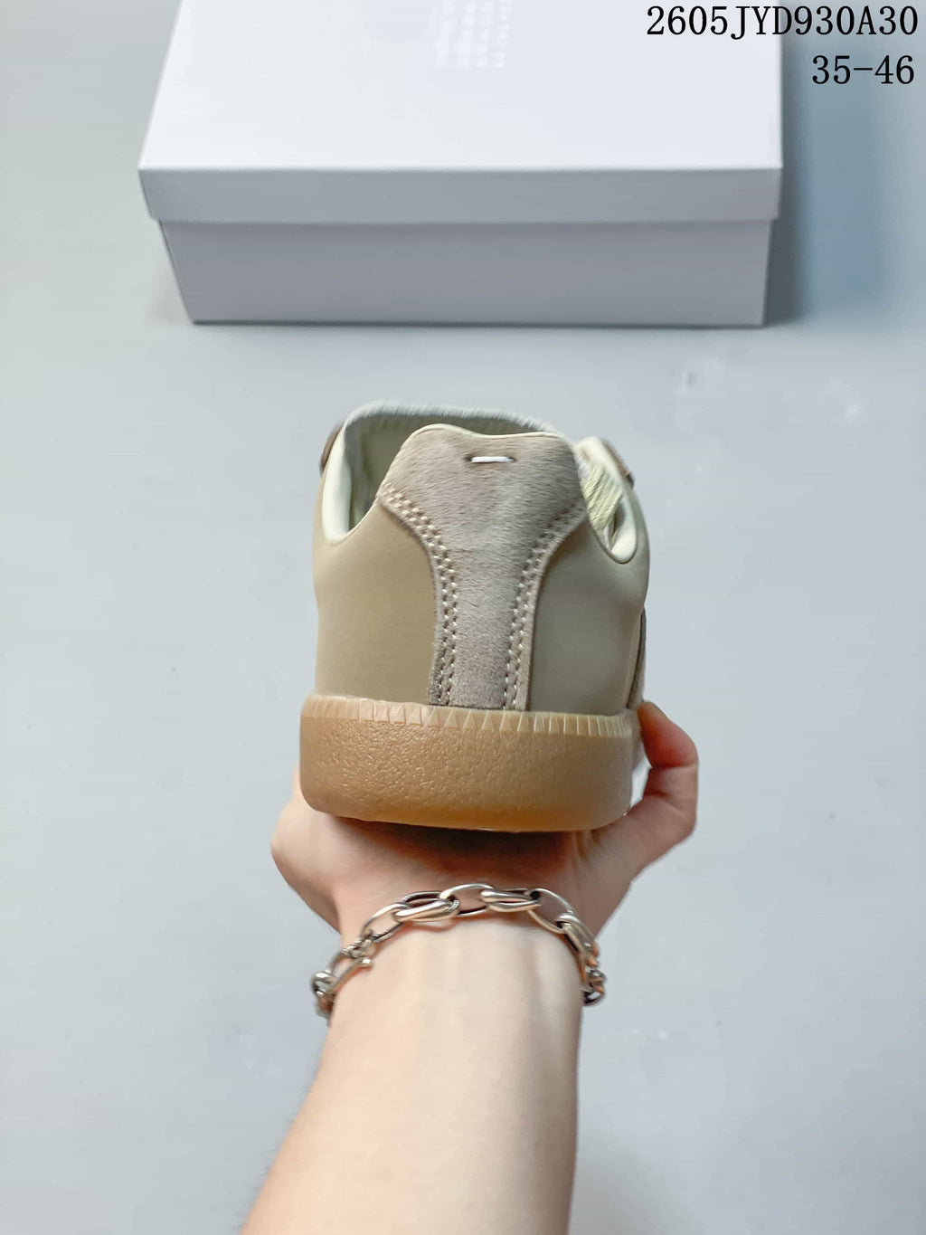 Rear view showing the sneaker heel and gum-colored sole.