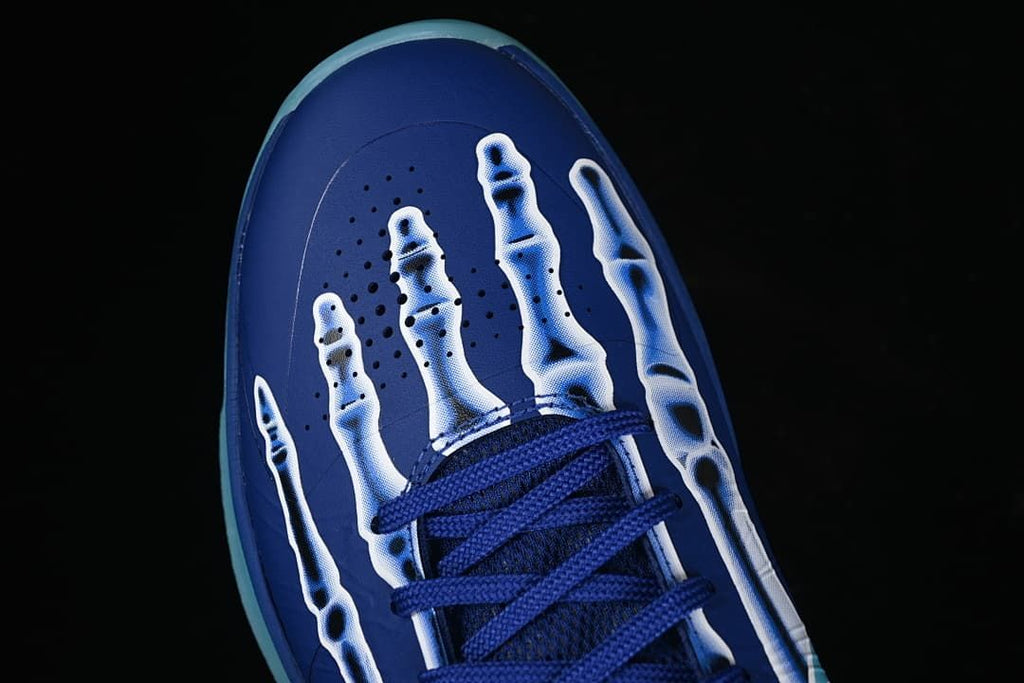 Top view of toe with skeleton graphic and blue laces