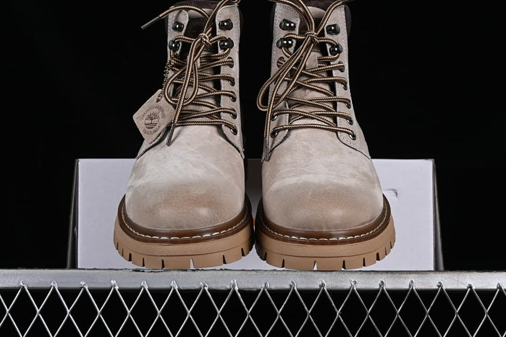 Front view of the pair showing lace-up fronts and lugged soles