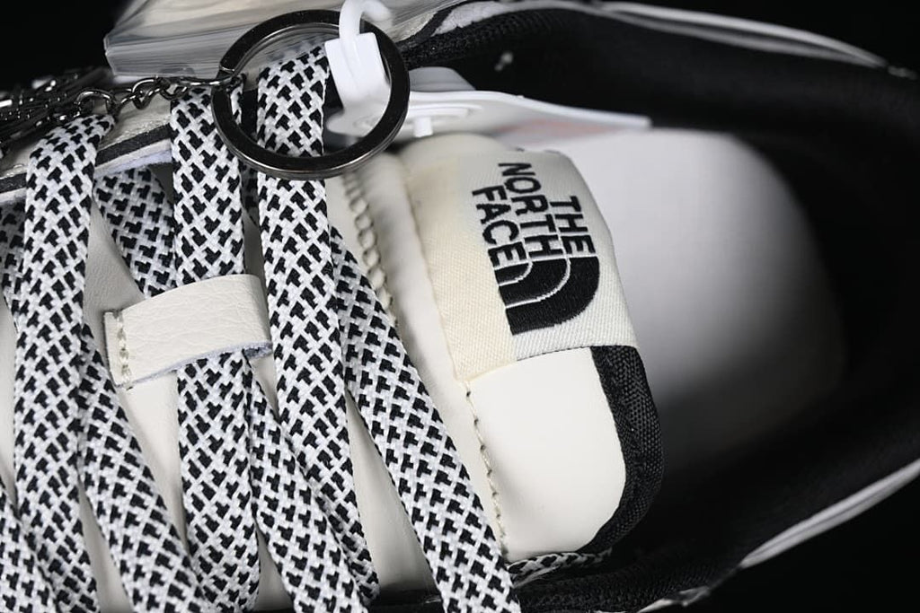 Close-up of black-and-white patterned laces and The North Face tongue label