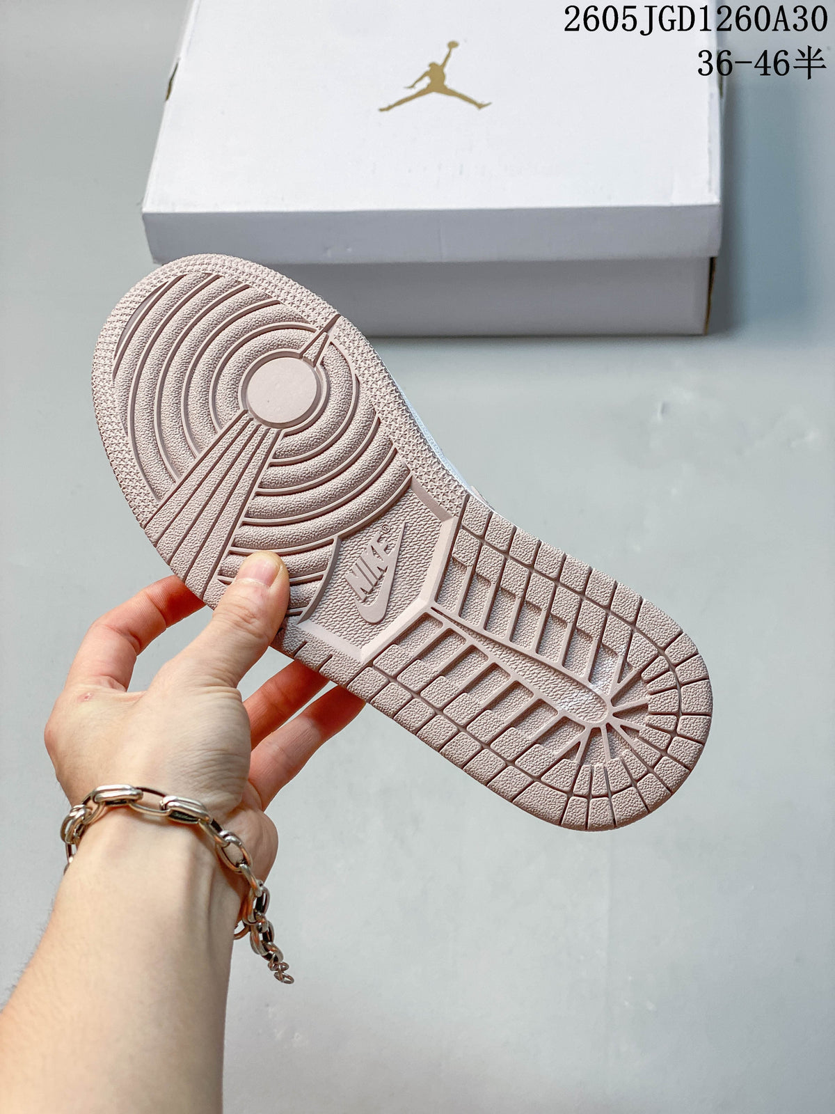 Close-up of the blush-pink textured outsole