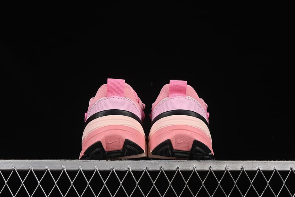 Rear view of the pair showing heel tabs and layered soles
