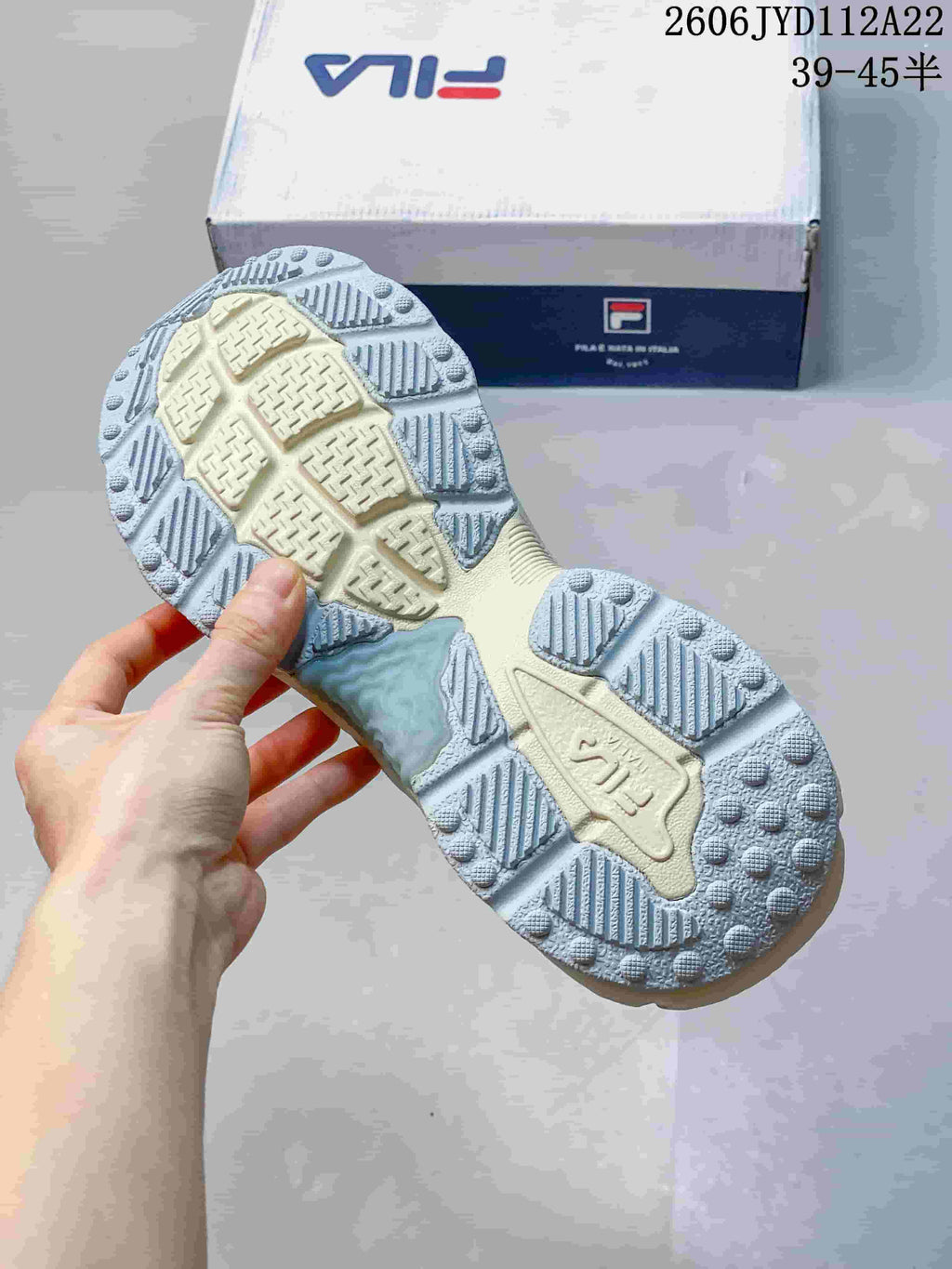 Close-up of the FILA sneaker outsole showing its patterned tread.