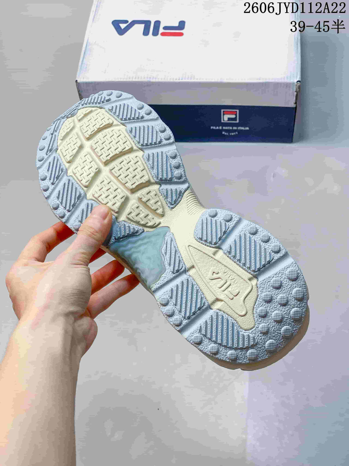 Close-up of the FILA sneaker outsole showing its patterned tread.