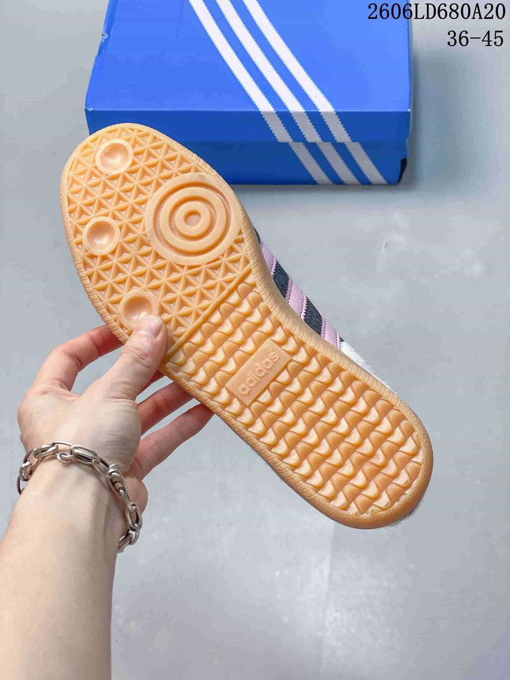 Underside view of the Adidas Samba OG gum-colored outsole with patterned tread