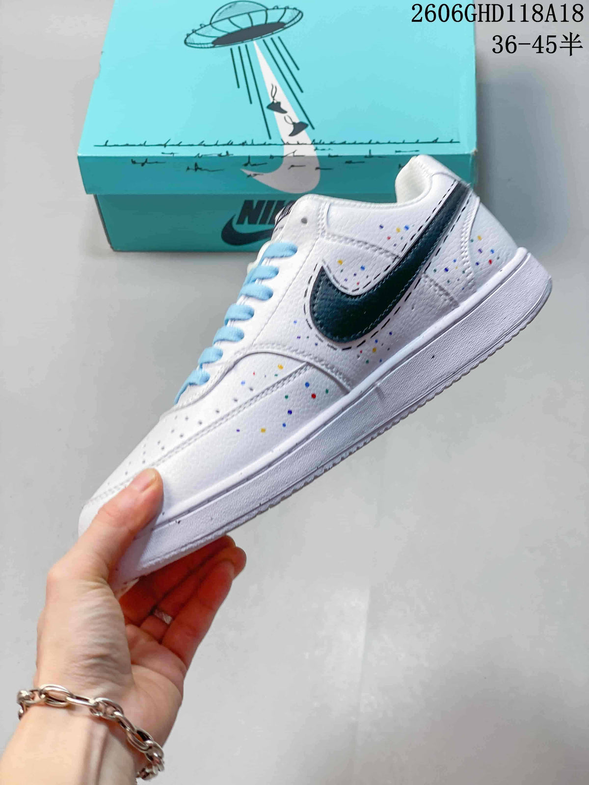 Side view showing the dark swoosh, perforations, and colorful details