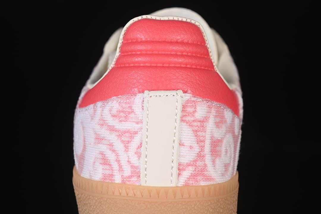 Rear view showing the coral heel accent and patterned heel panels