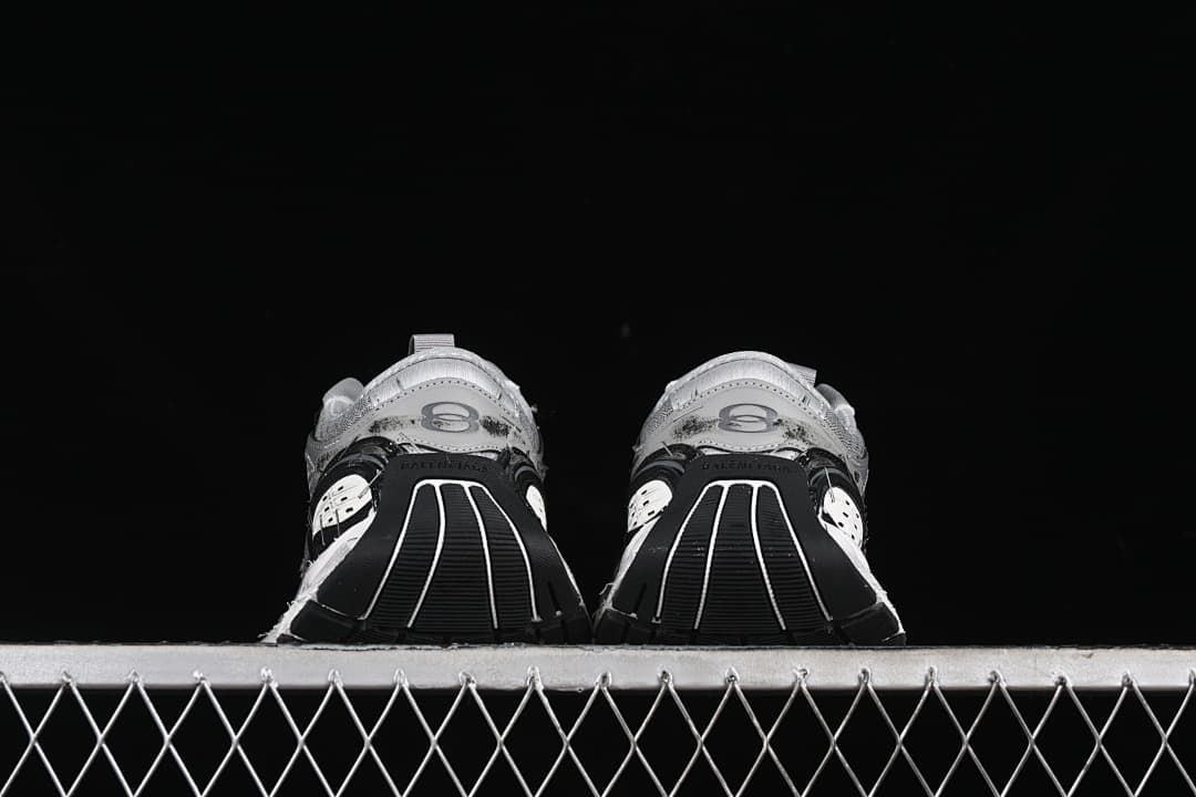 Rear view of both sneakers showing the heel and outsole design