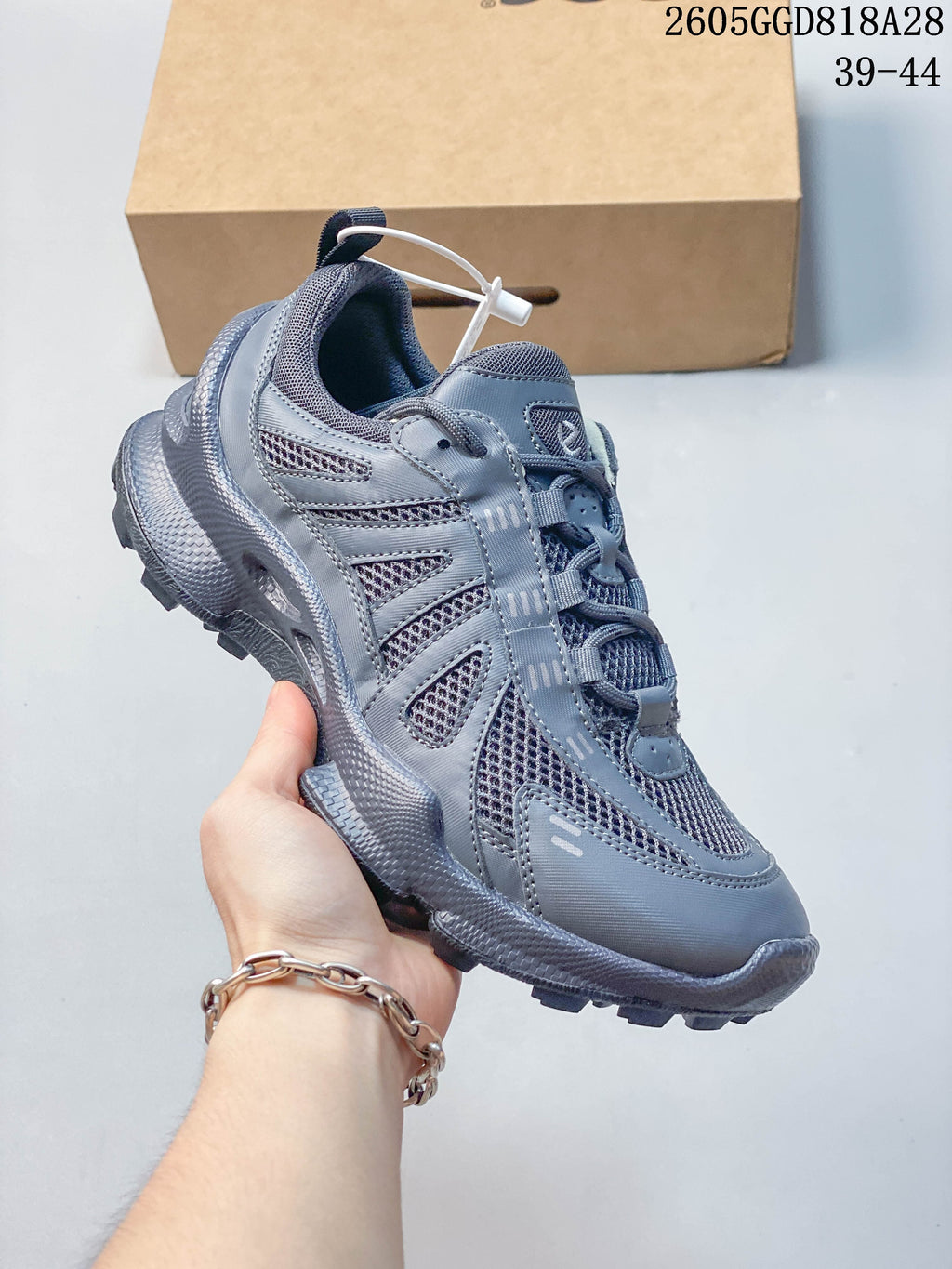 Side view of the gray Ecco sneaker with a chunky lugged outsole