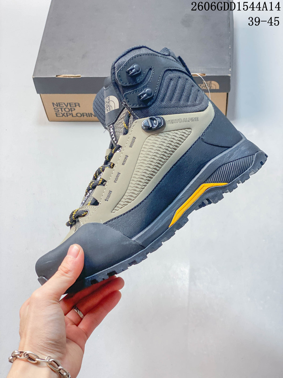 Side view of a Verto Alpine boot showing its high-top profile, lace hooks, and color-blocked upper.