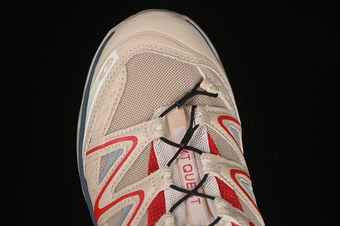 Top-down close-up of the toe, mesh panels, and lace system