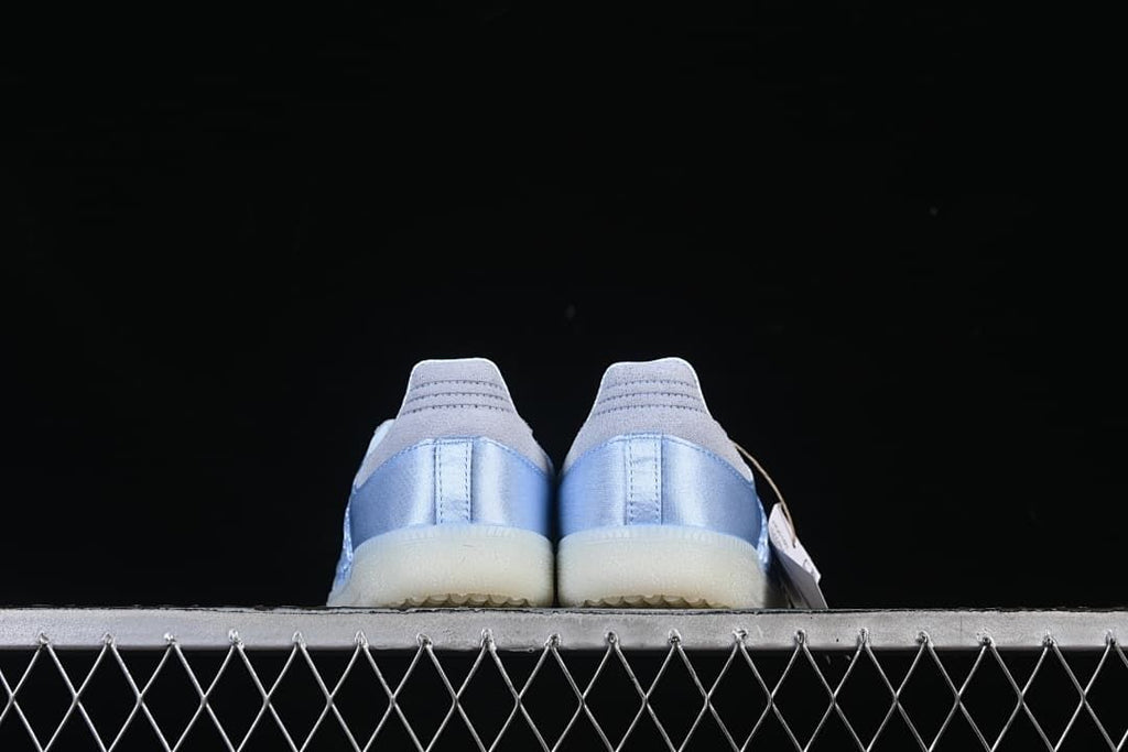 Rear view of both shoes showing satin-look heel panels