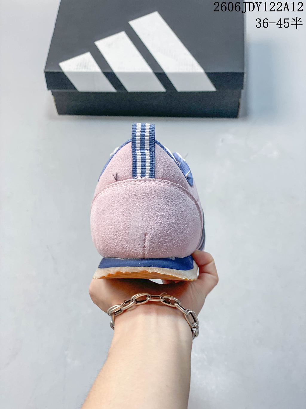 Rear view showing the pink heel, blue trim, and striped pull tab