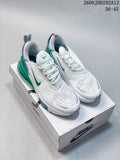 Pair of white Nike Air Max 270 sneakers with green and blue accents on a shoe box