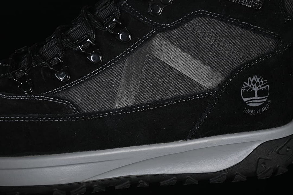 Close-up of the boot’s side panels, stitching, Timberland logo, and midsole.