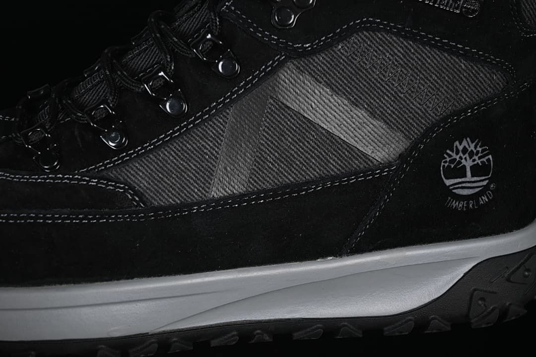 Close-up of the boot’s side panels, stitching, Timberland logo, and midsole.