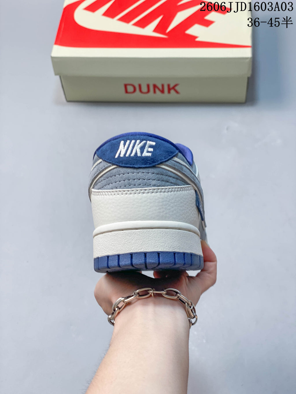 Rear view of the sneaker showing the heel panel and blue outsole