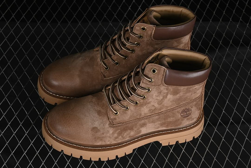 Pair of khaki-brown lace-up boots shown at an angle