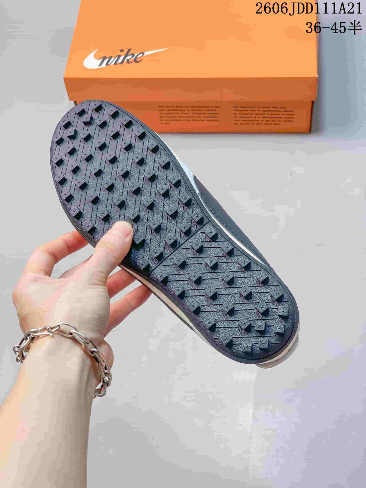 Close-up of the dark textured outsole on a Nike Moon Shoe OG Summit sneaker