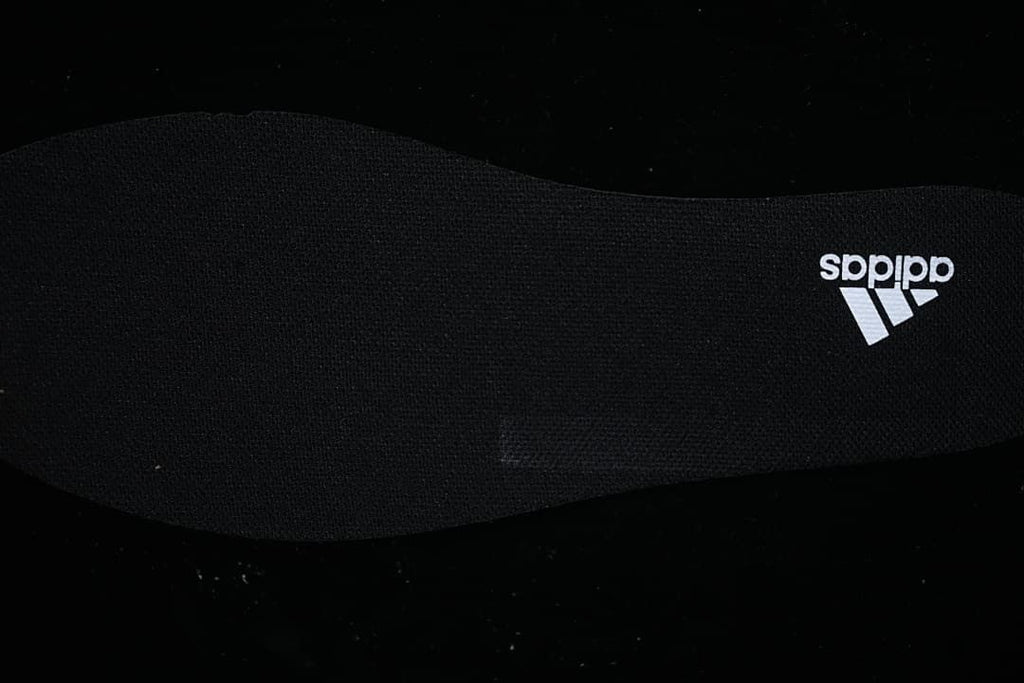 Close-up of the black insole with adidas branding