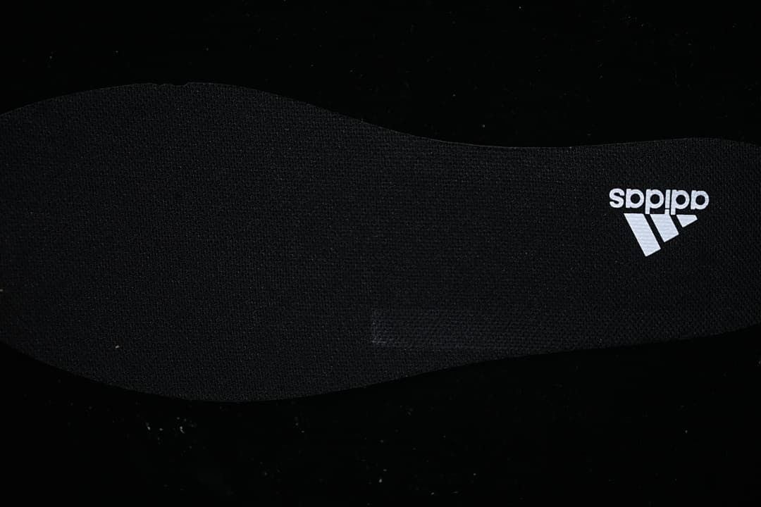 Close-up of the black insole with adidas branding