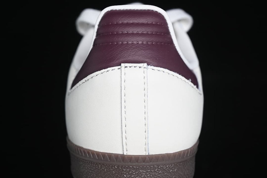 Rear view showing burgundy heel detail and dark outsole
