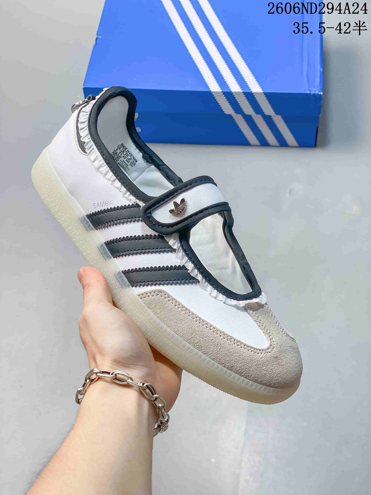 White adidas Samba Jane sneaker with dark stripes, trim and strap closure