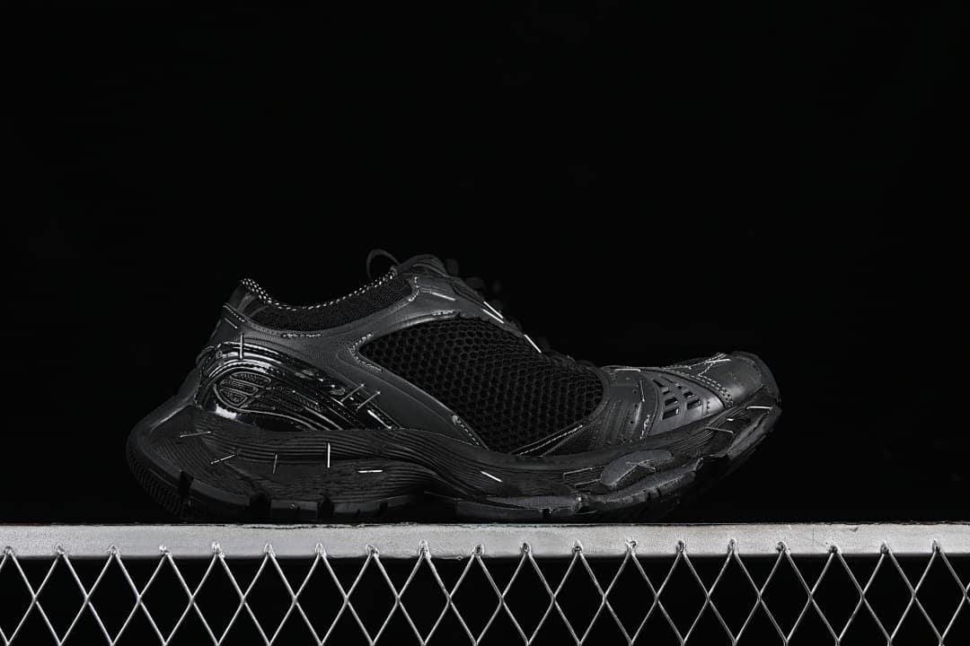 Black sneaker shown from the opposite side in profile.