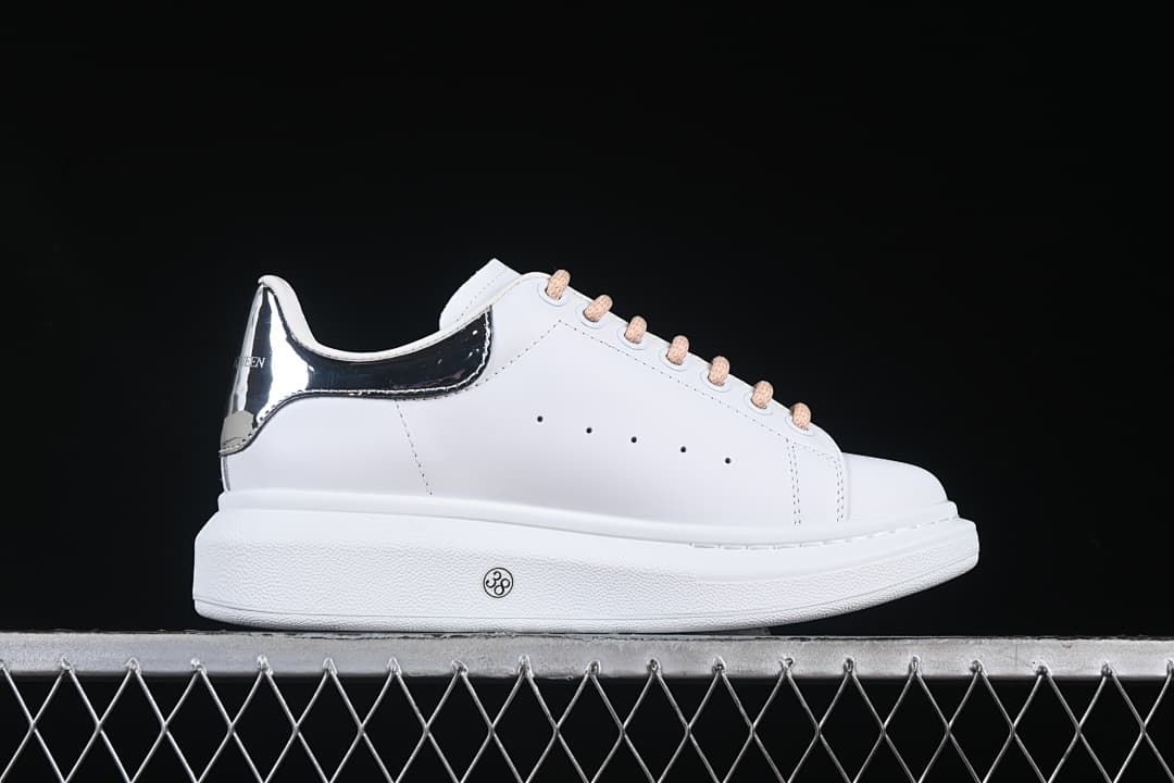 Side view showing the white upper and thick sole
