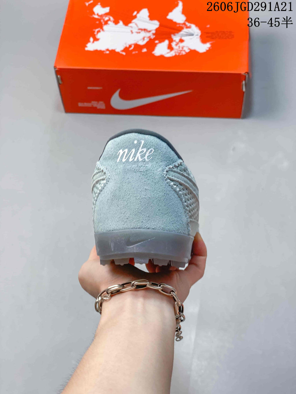 Rear view of the sneaker showing the heel panel and low-profile sole