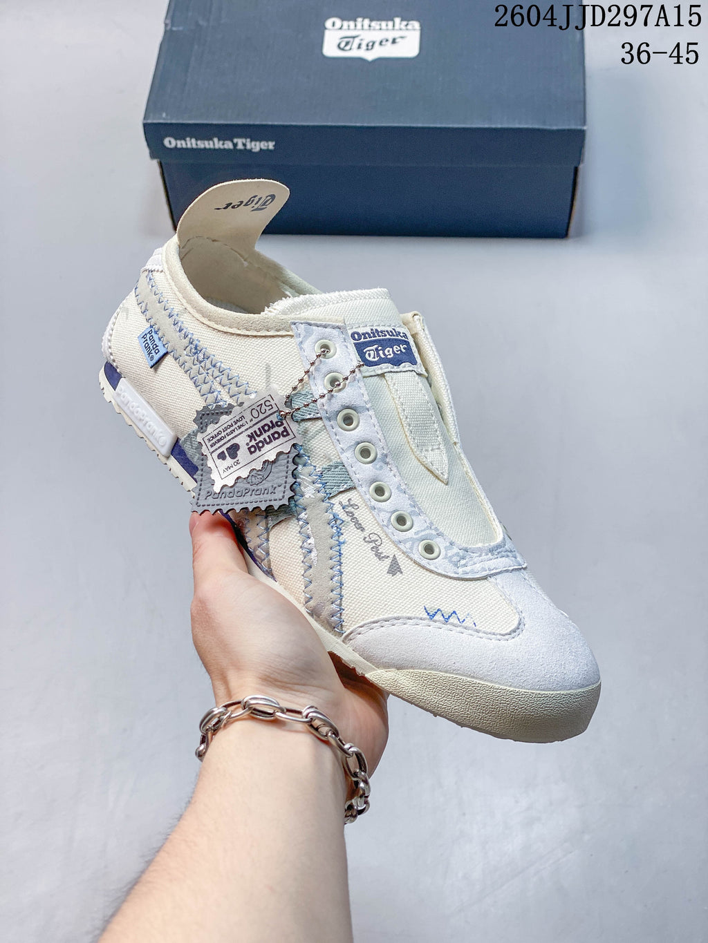 Cream Onitsuka Tiger sneaker with pale blue detailing and decorative stitching