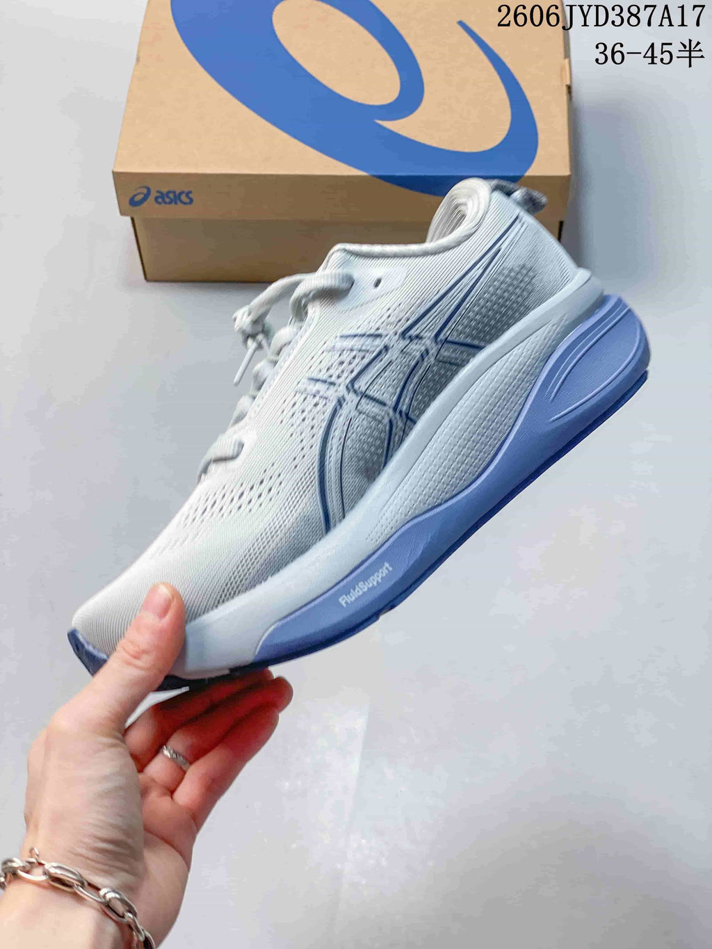 Side view of the white and blue ASICS Gel-Kayano 33 running shoe