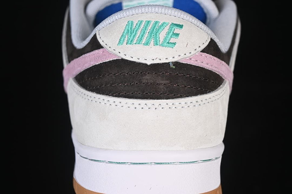 Rear view showing layered heel panels and pink accent
