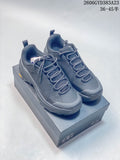 Pair of dark gray Kolon Sport low-cut hiking sneakers on a box