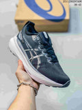 Dark gray ASICS running shoe with light accents and sculpted white midsole
