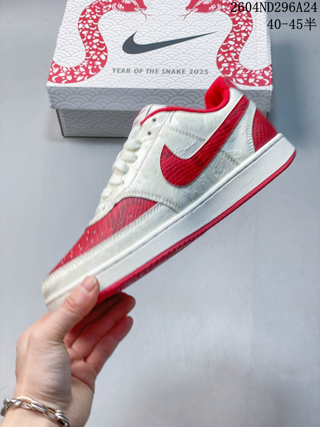 Side profile showing the red Swoosh and textured white panels
