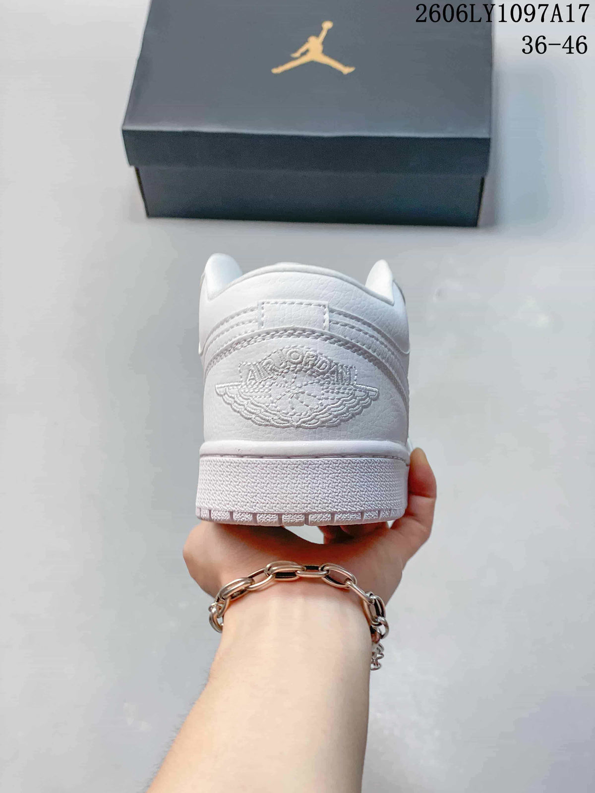 Rear view of a white low-top sneaker with embroidered heel detail