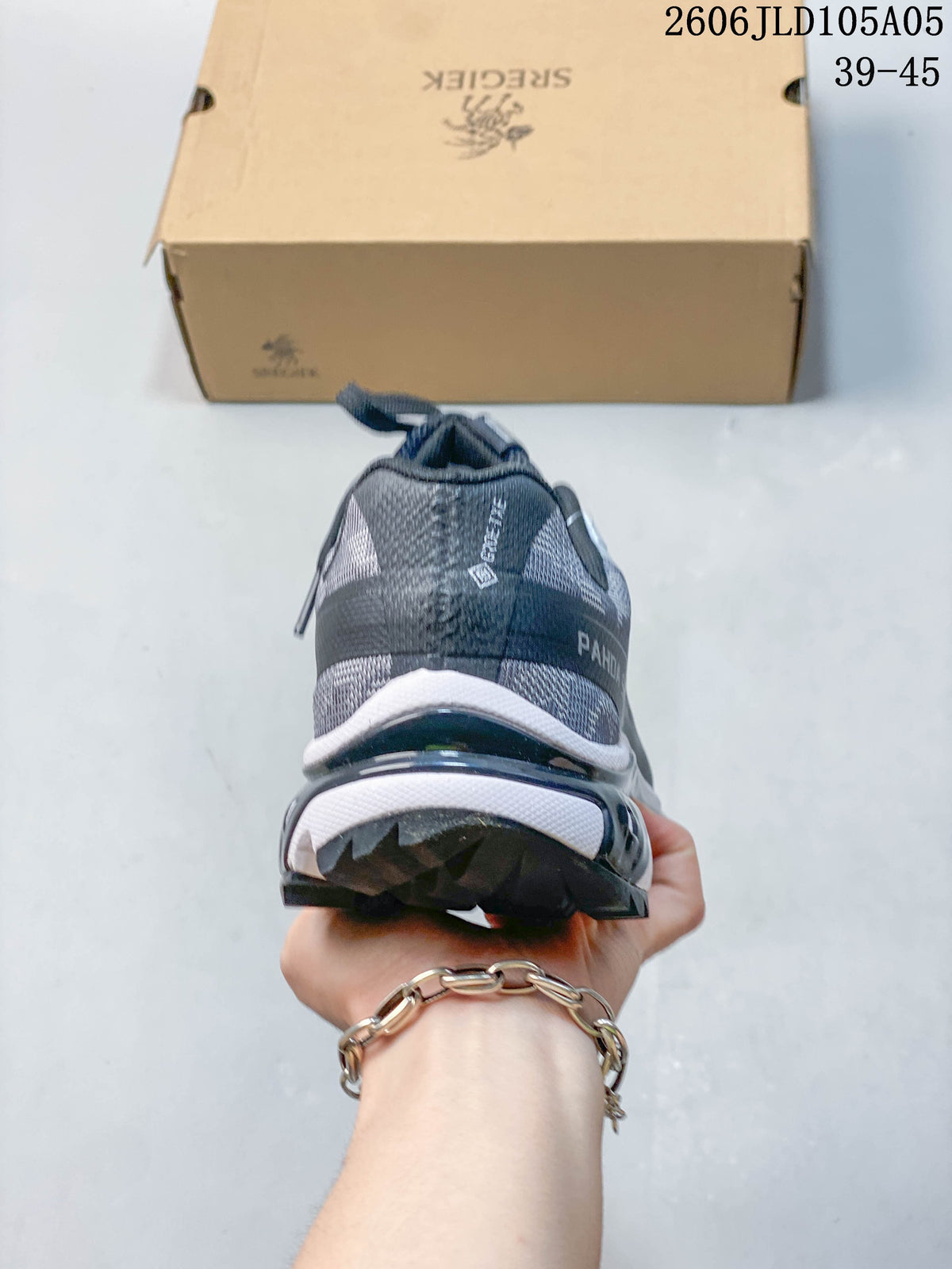 Rear view of the gray trail sneaker showing the heel and outsole.