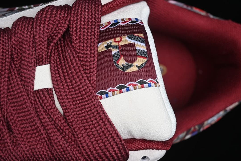 Close-up of burgundy laces and patterned tongue detail