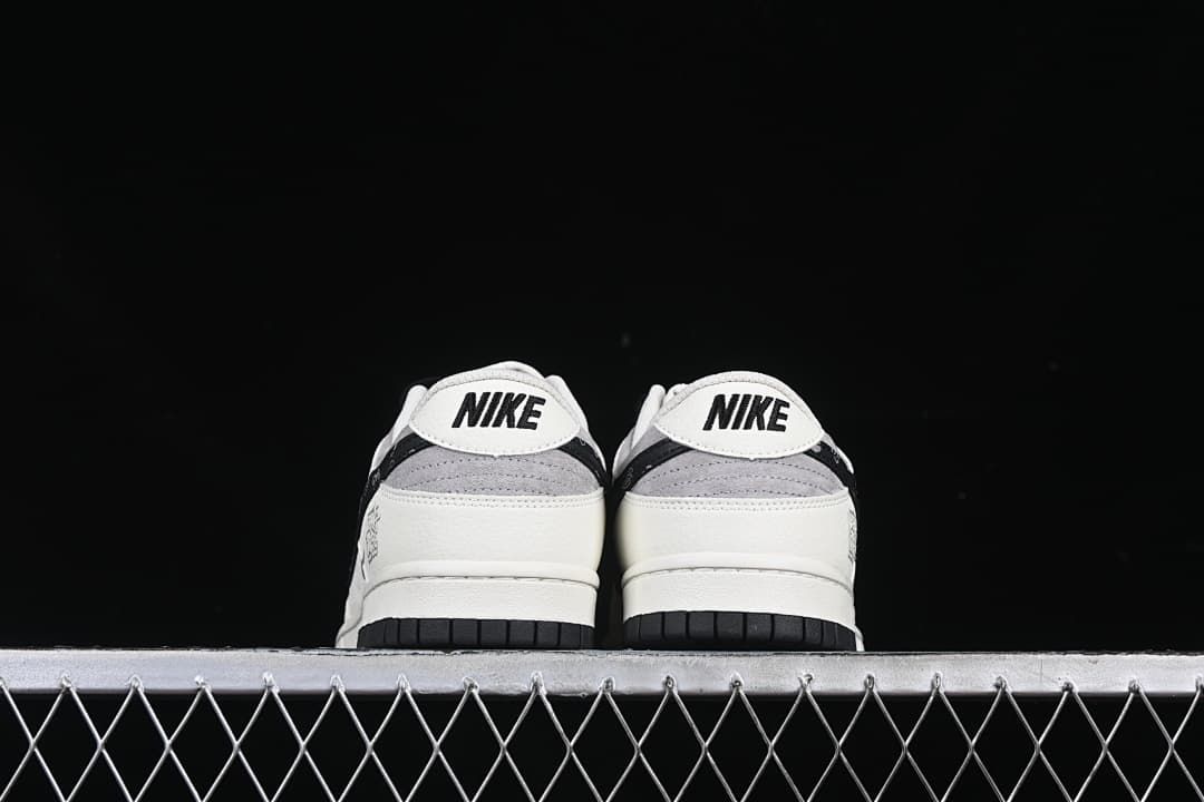 Rear view of both shoes with Nike heel branding and black outsoles